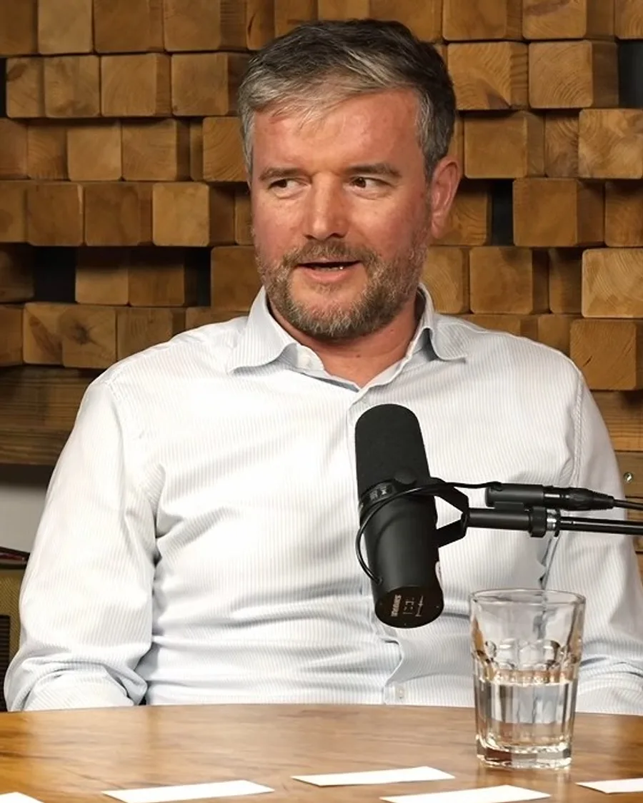 One of the two Doppelgänger hosts talking in the Founder Mode studio